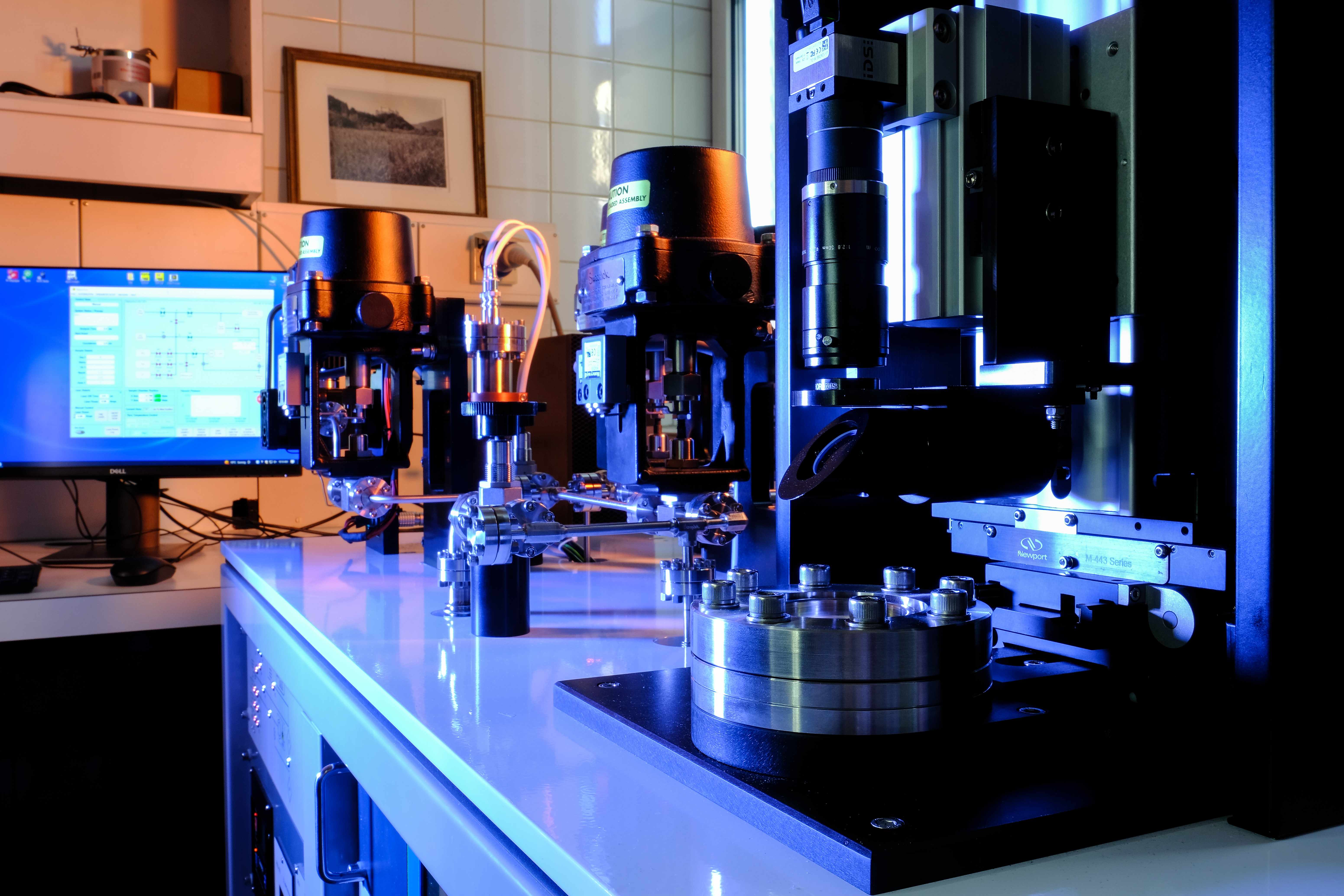 Alphachron precision instruments in laboratory bathed in blue light